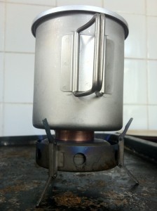 Titanium Triad XE Alcohol / Fuel Tab Stove Titanium Triad XE Alcohol / Fuel Tab Stove - MSR Titanium mug used as a cooking pot