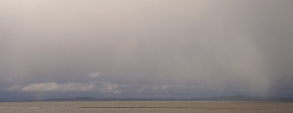 Bad weather over the Lake District seen across Morecambe Bay