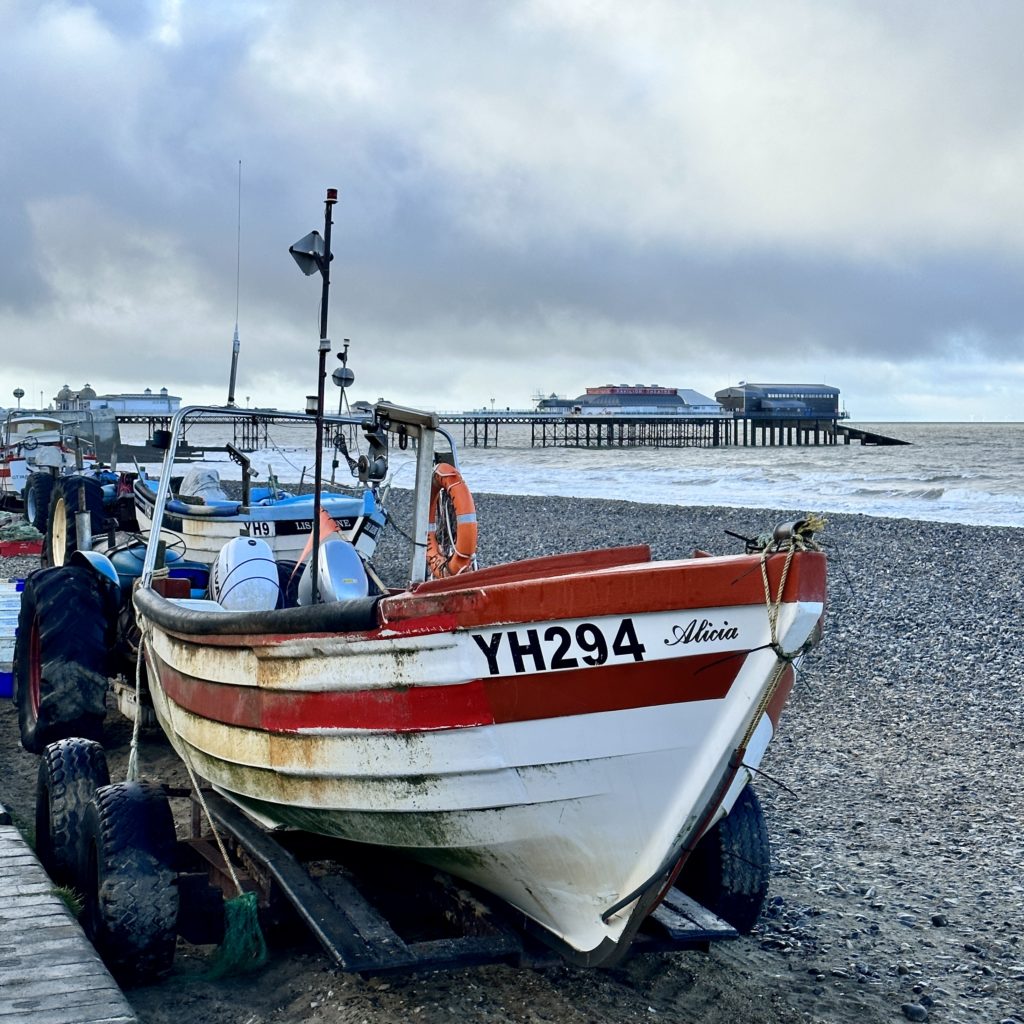 Fishing boats and Cromer Pier