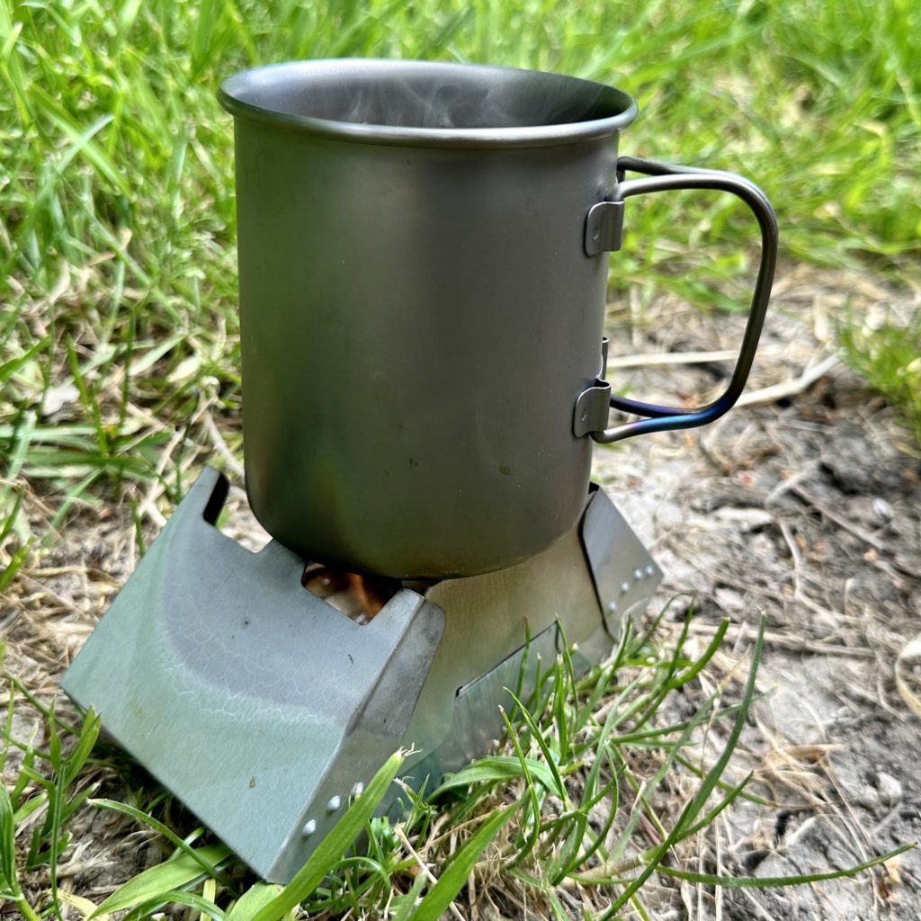 Making coffee using an Alpkit titanium mug on a British Army BCB folding stove 