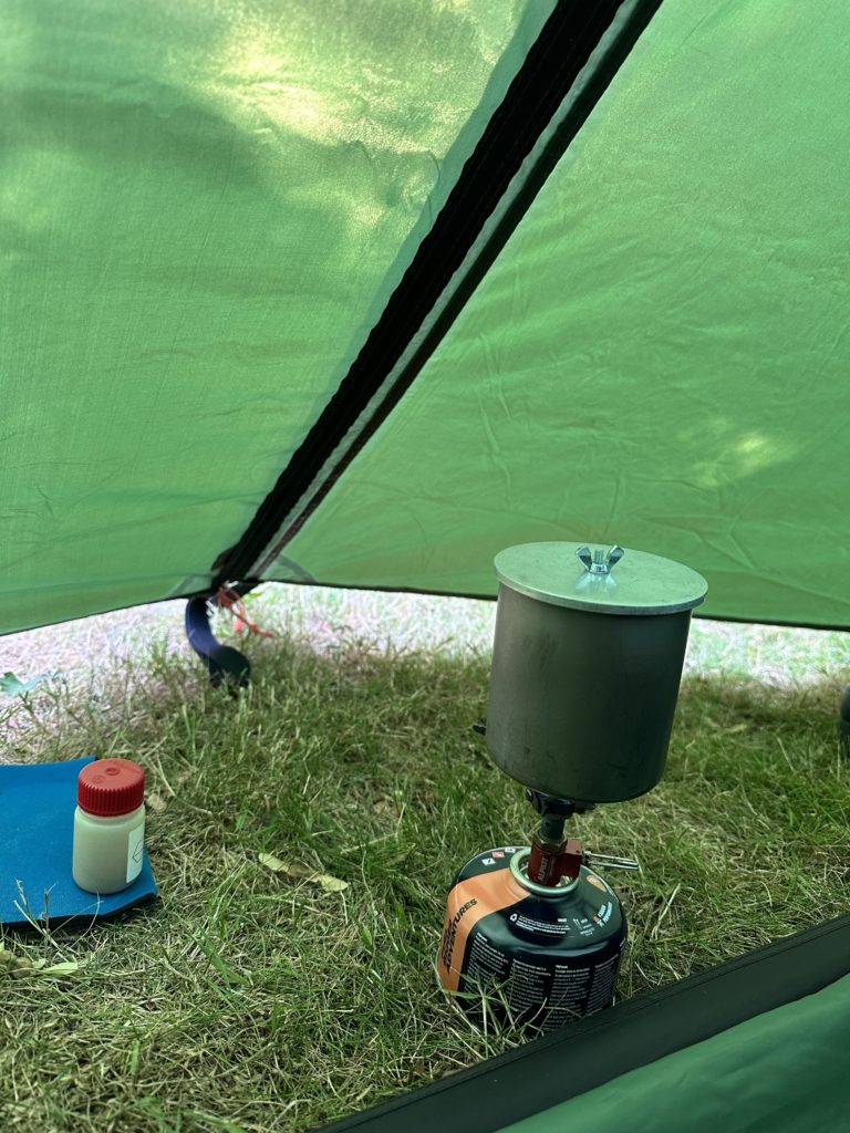 Alpkit Kraku stove, a titanium mug and homemade lid - lightweight cook set.