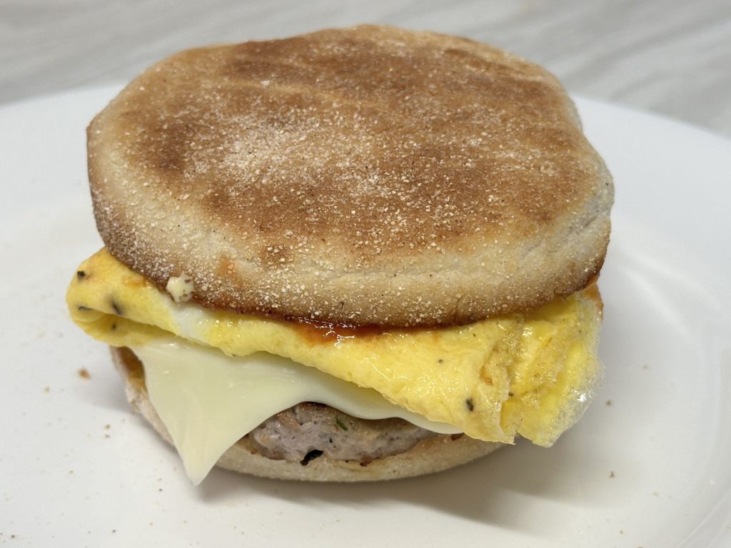 Home made muffin sausage and egg breakfast