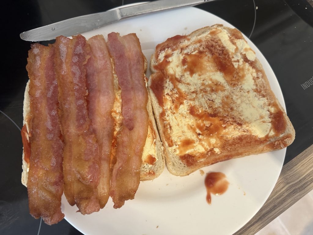 Smoked streaky bacon, white bread and ketchup