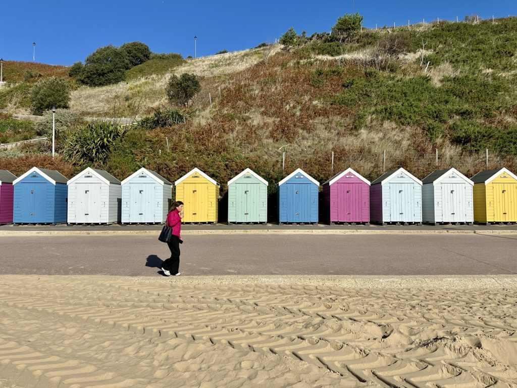 Beach huts and lady