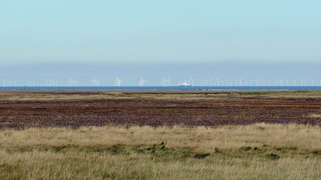 wind turbines out at sea on an iPhone 17 Pro Max