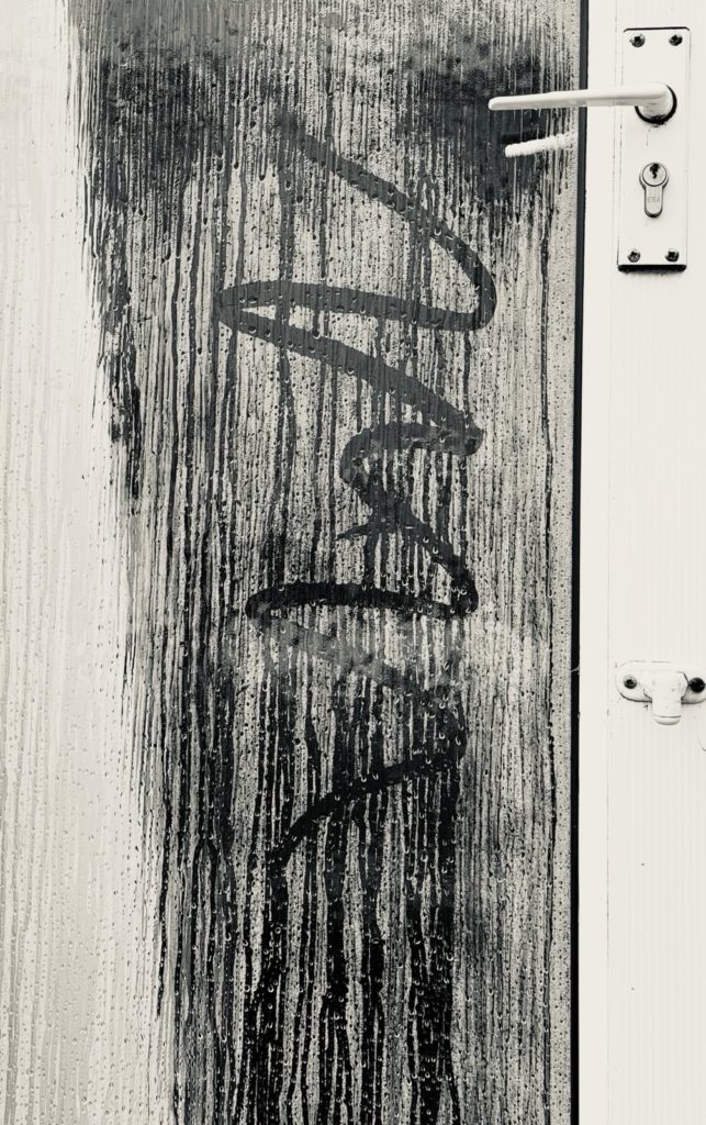 Artwork in the condensation in the door