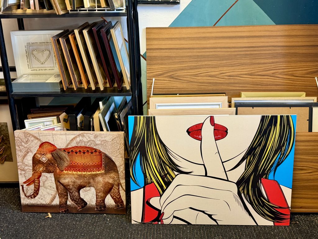 pictures for sale in a charity shop